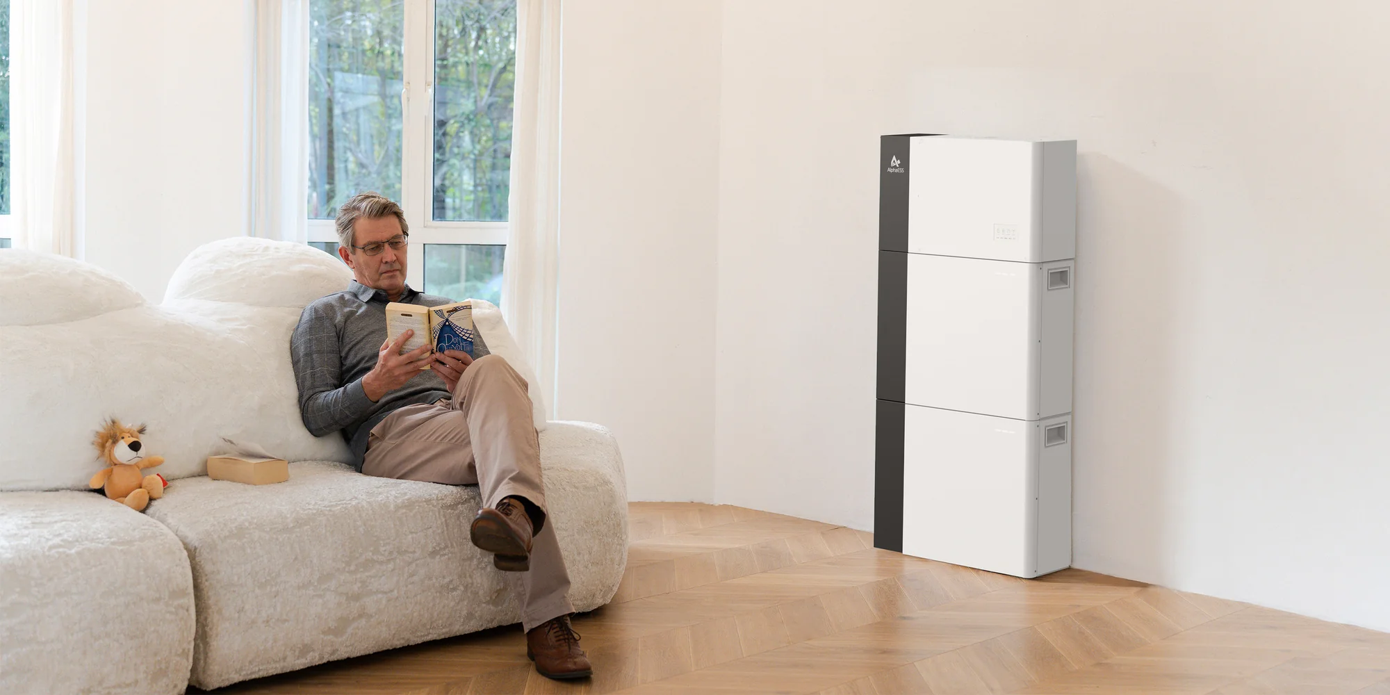 Man relaxing at home with home battery system in living room