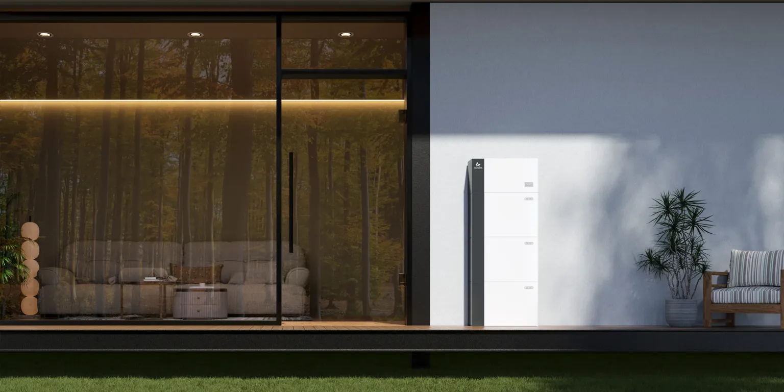 Modern home with battery system at night